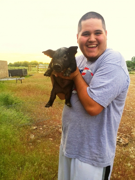 Student with piglet