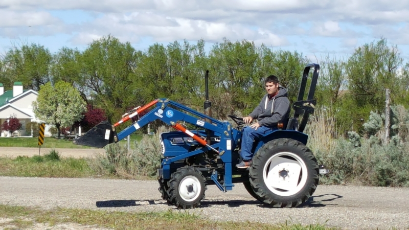 Student learning to use the tractor