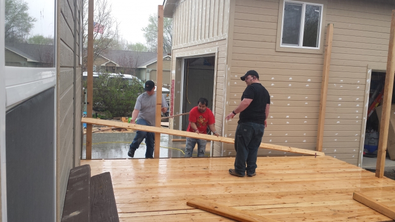 Students and mentor installing new deck